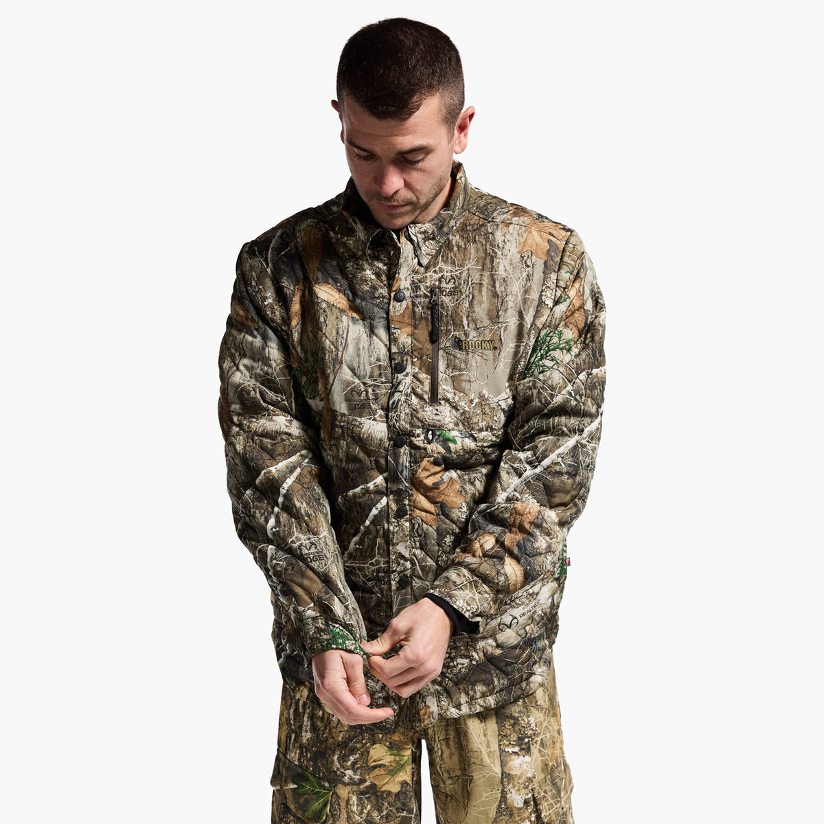 Man wearing a camouflage outfit on a white background